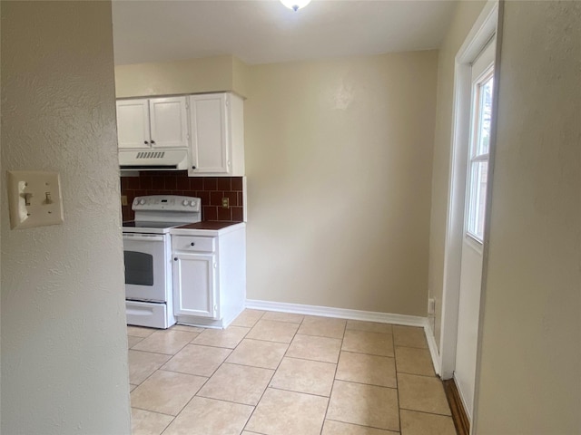 kitchen featuring white cabinetry, backsplash, white electric range, and light tile patterned flooring