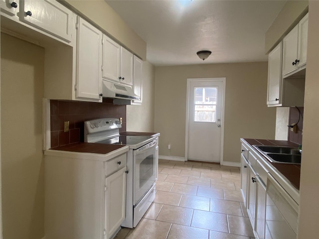 kitchen with white cabinetry, white appliances, and decorative backsplash