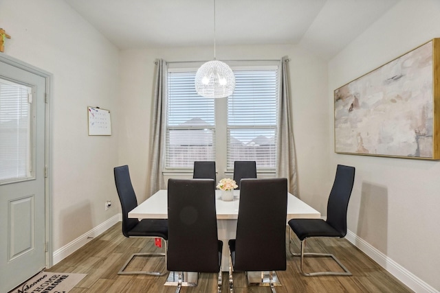 dining room with a chandelier and hardwood / wood-style floors