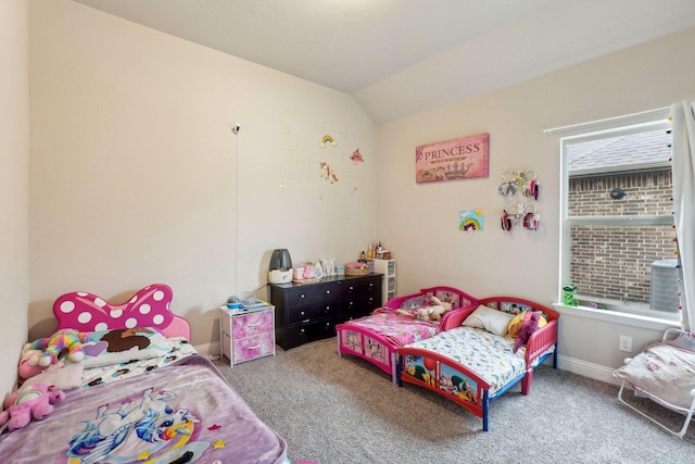 bedroom featuring multiple windows, vaulted ceiling, and carpet