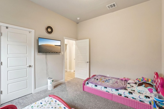 bedroom with light carpet