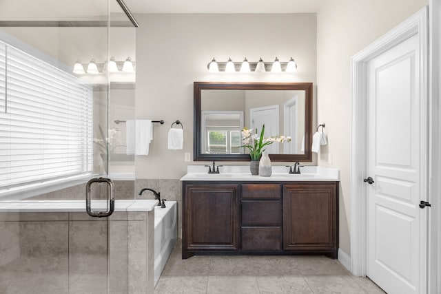 bathroom featuring tile patterned flooring, vanity, and plus walk in shower