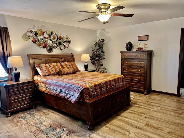 bedroom with ceiling fan and light wood-type flooring