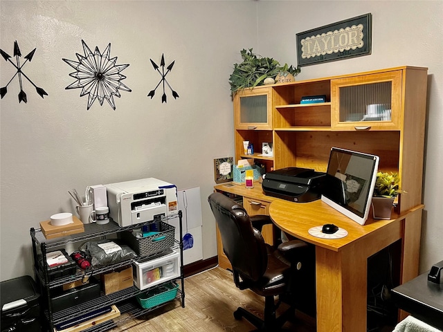 office area with light hardwood / wood-style flooring