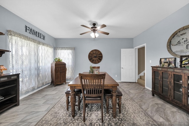 dining space with ceiling fan