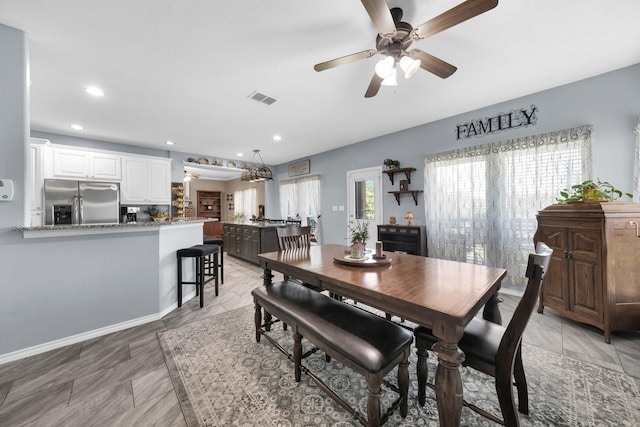 dining room featuring ceiling fan