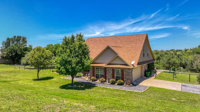 view of front of property with a garage and a front yard