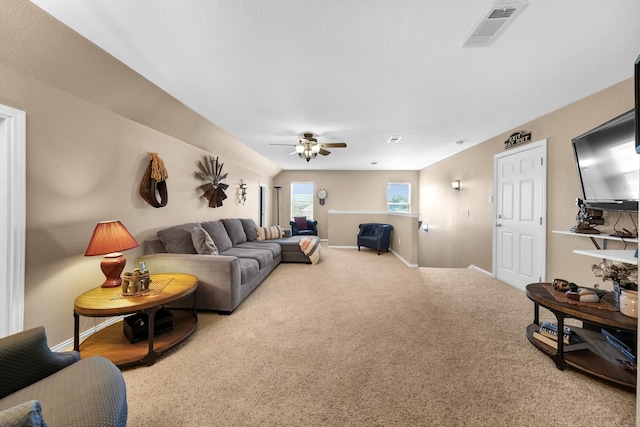 living room with carpet and ceiling fan