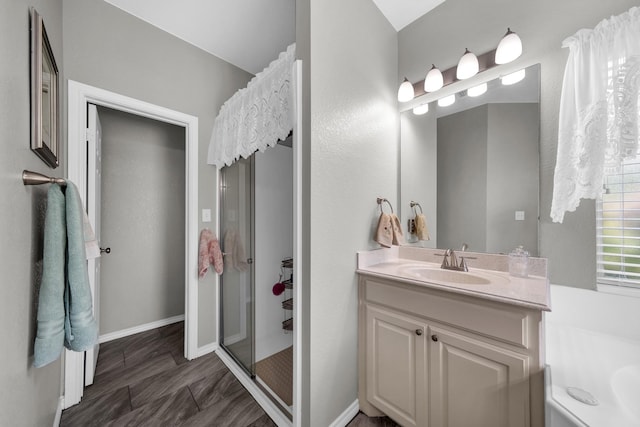 bathroom featuring vanity, an enclosed shower, and hardwood / wood-style floors