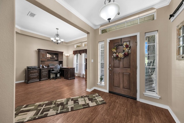 entrance foyer featuring crown molding, dark hardwood / wood-style flooring, and a notable chandelier