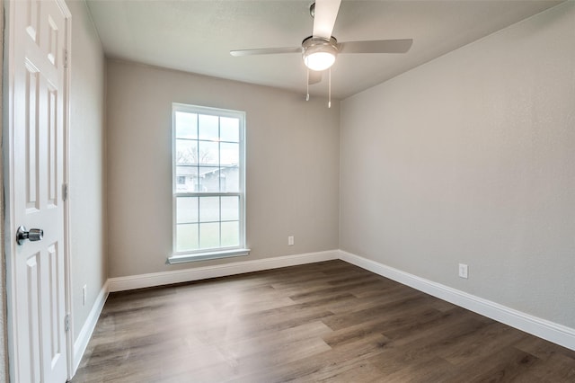 spare room featuring hardwood / wood-style floors and ceiling fan