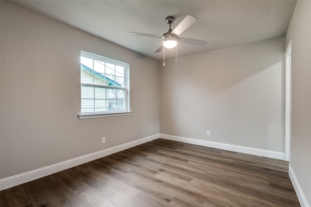 unfurnished room with wood-type flooring and ceiling fan