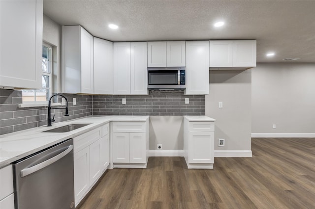 kitchen featuring white cabinetry, sink, and stainless steel appliances