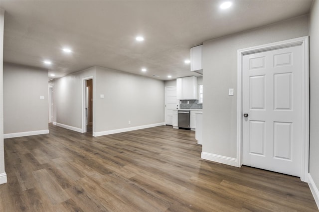 unfurnished living room with dark hardwood / wood-style flooring