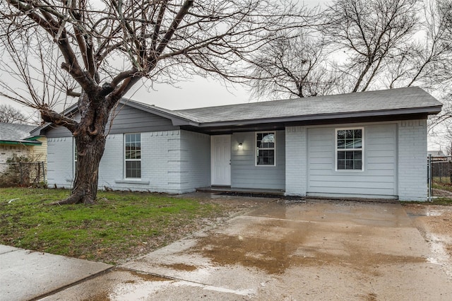 ranch-style house with a front lawn