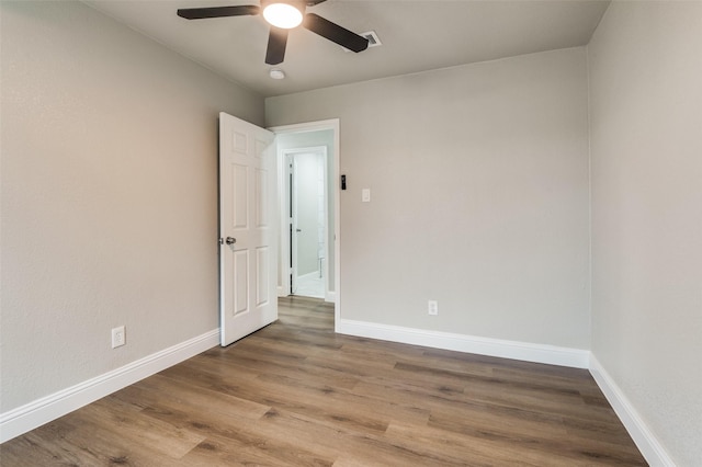 spare room featuring ceiling fan and light wood-type flooring