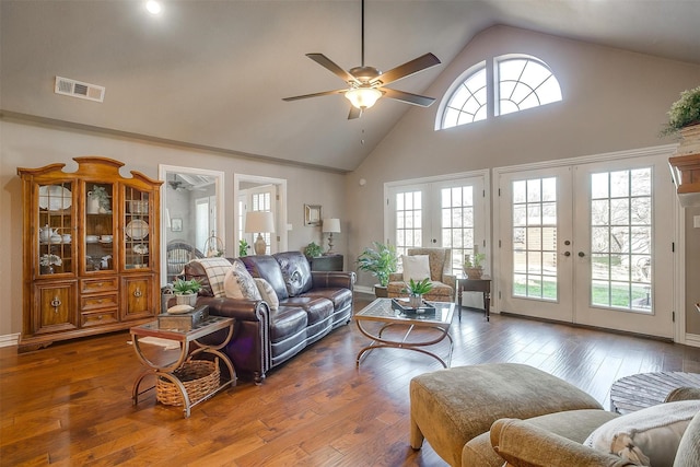 living room with hardwood / wood-style flooring, plenty of natural light, and french doors