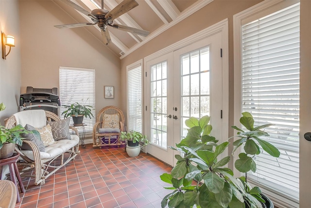 sunroom with french doors, ceiling fan, and vaulted ceiling with beams