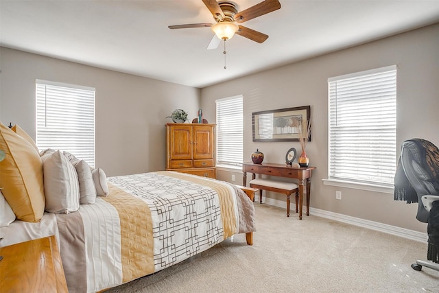 bedroom with light carpet and ceiling fan