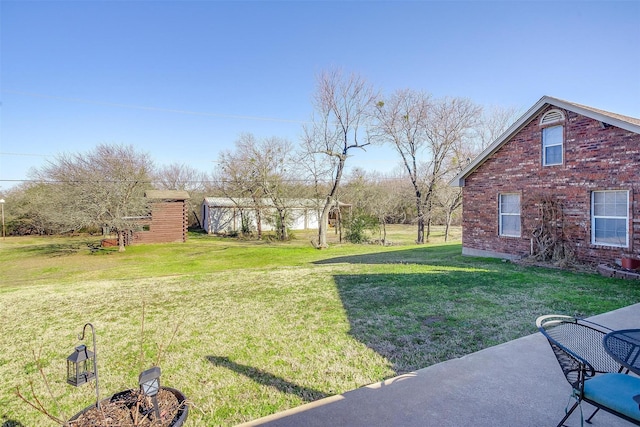 view of yard with a patio area