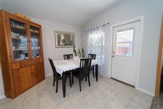 dining area with lofted ceiling