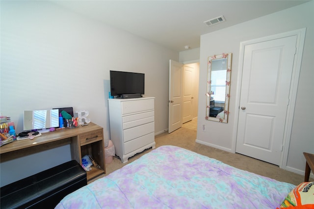 bedroom with light carpet