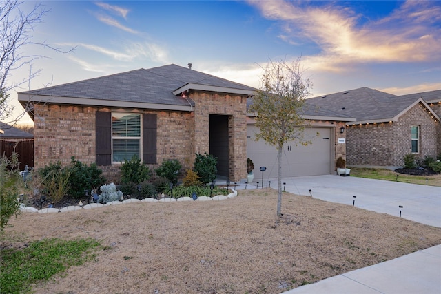 ranch-style home featuring a garage