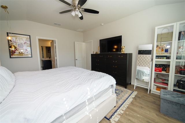 bedroom with lofted ceiling, light hardwood / wood-style floors, and ceiling fan