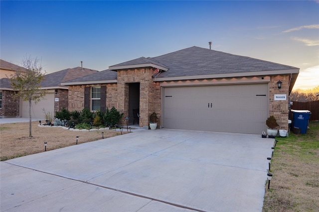 ranch-style house featuring a garage