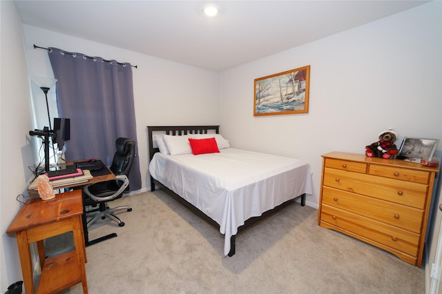 bedroom featuring light colored carpet