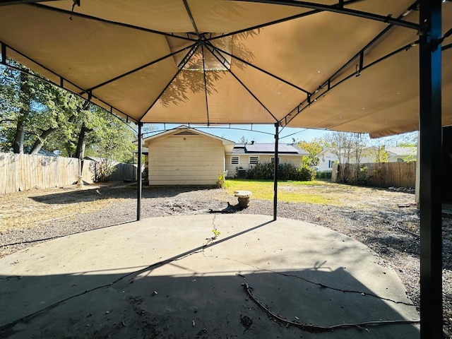 view of patio / terrace with a shed