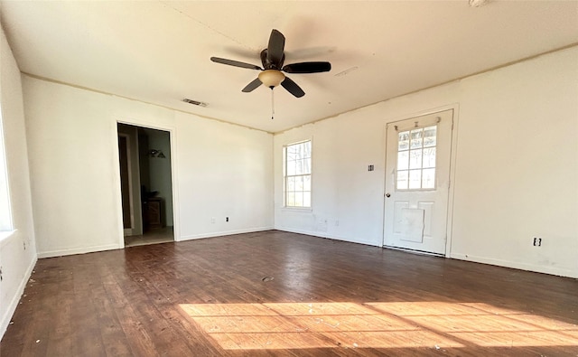 unfurnished room featuring dark wood-type flooring and ceiling fan