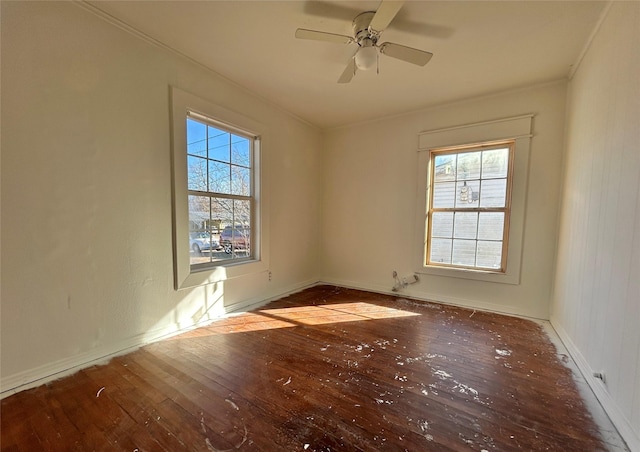 empty room featuring hardwood / wood-style floors and ceiling fan