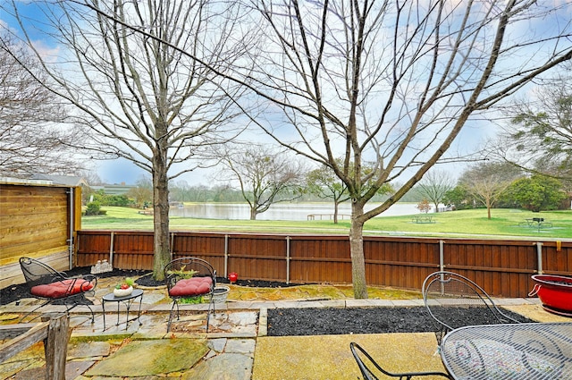 view of patio featuring a water view