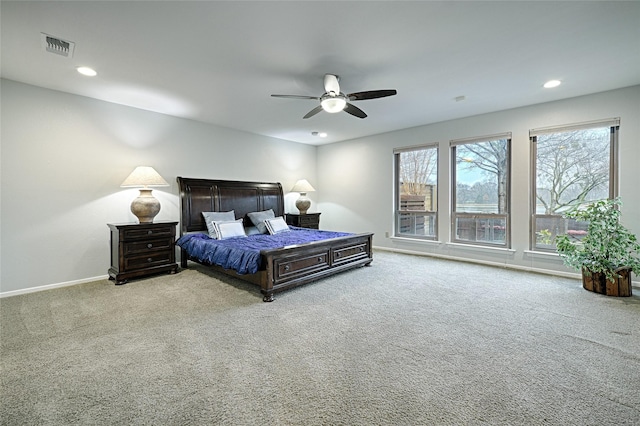 bedroom featuring light carpet, recessed lighting, visible vents, and baseboards