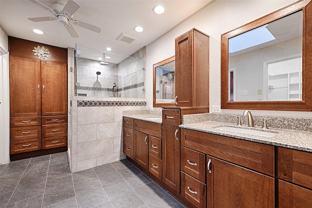 bathroom with a walk in shower, recessed lighting, a ceiling fan, vanity, and visible vents