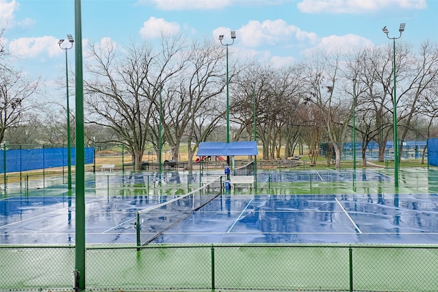 view of sport court with fence