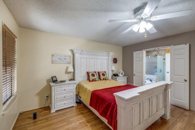 bedroom with ceiling fan, a textured ceiling, and light wood-type flooring