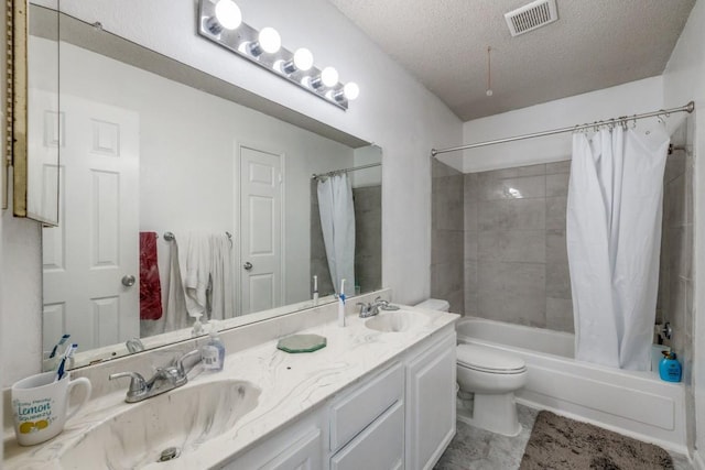 full bathroom with shower / bath combo, vanity, a textured ceiling, and toilet