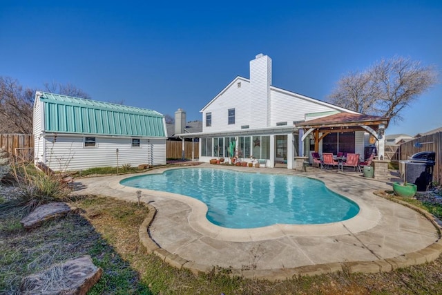 view of swimming pool featuring a gazebo and a patio