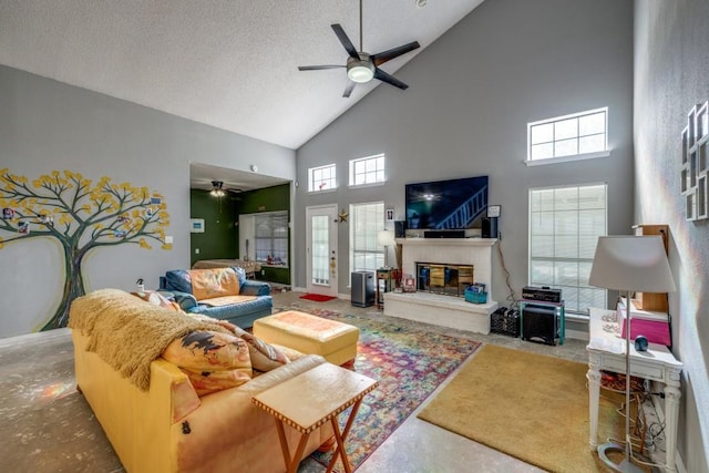 living room with high vaulted ceiling, concrete floors, a brick fireplace, a textured ceiling, and ceiling fan