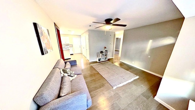 living room with hardwood / wood-style flooring and ceiling fan