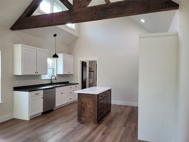 kitchen featuring a center island, dishwasher, hanging light fixtures, and white cabinets