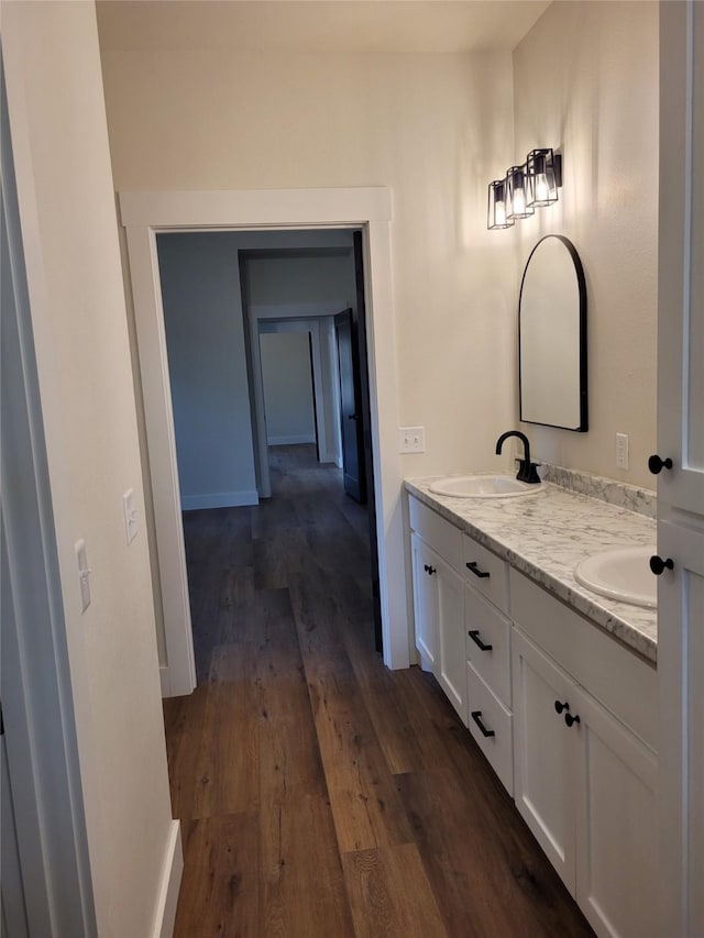 bathroom with vanity and hardwood / wood-style floors