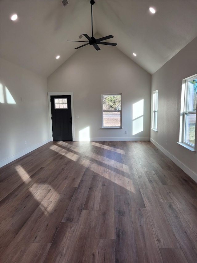 unfurnished living room featuring ceiling fan, dark hardwood / wood-style floors, and high vaulted ceiling