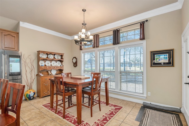 dining area featuring ornamental molding, light tile patterned floors, and a chandelier