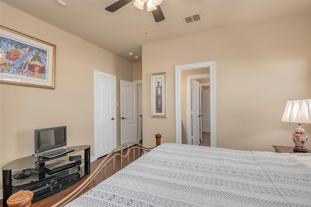 bedroom with hardwood / wood-style floors and ceiling fan