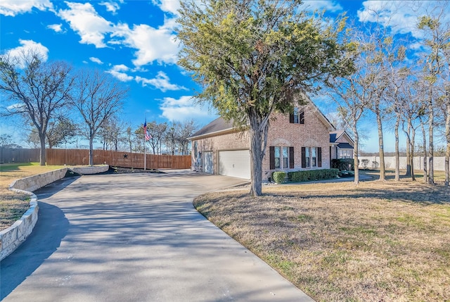 view of home's exterior featuring a garage and a yard