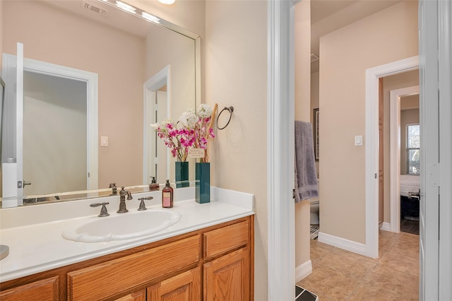 bathroom with vanity and tile patterned floors