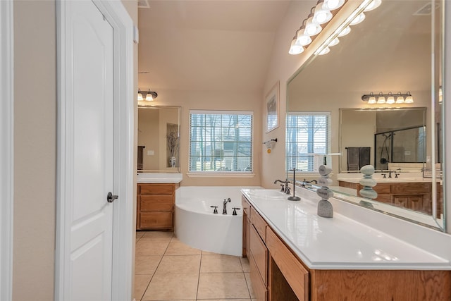 bathroom with vanity, plus walk in shower, and tile patterned flooring